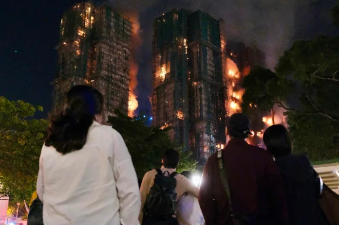 Hong Kong residential fire: Death toll rises to 13 as residents trapped in burning towers