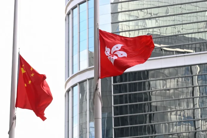 Hong_Kong_mourns_fire_victims_with_flags_at_half-mast Hong Kong mourns fire victims with flags at half-mast