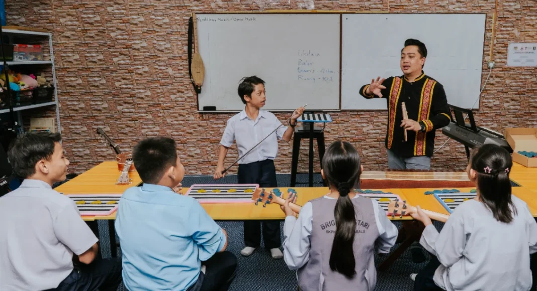 Hearing- impaired students with teacher Stefanus, who believes students need the opportunity to grow despite their disabilities.