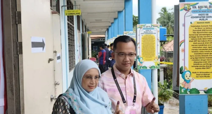 PH candidate Ruji Ubi votes in Sabah's Merotai seat election