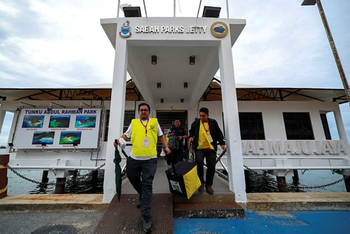 Sabah election commission begins opening postal ballot envelopes Sabah election commission begins opening postal ballot envelopes