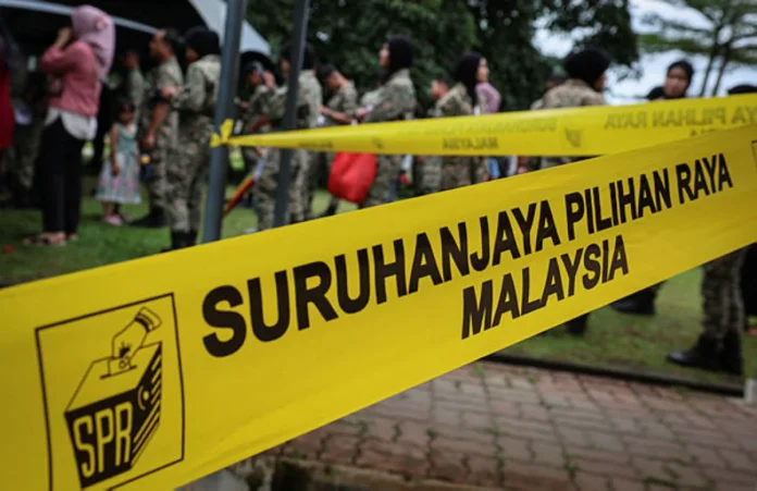 Rain fails to disrupt early voting in Sabah state election