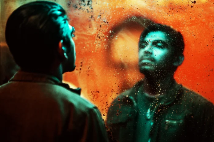 Karnan as Siam, a quiet drug smuggler caught in a spiral of crime and consequences in Macai.