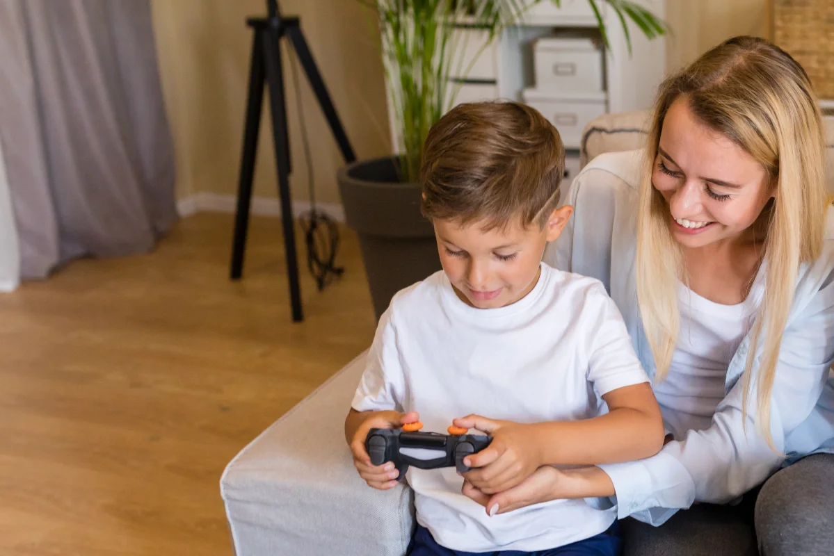 mother son playing with gamepad