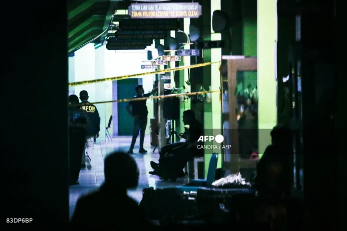 Indonesia probes student after nearly 100 hurt in school blasts