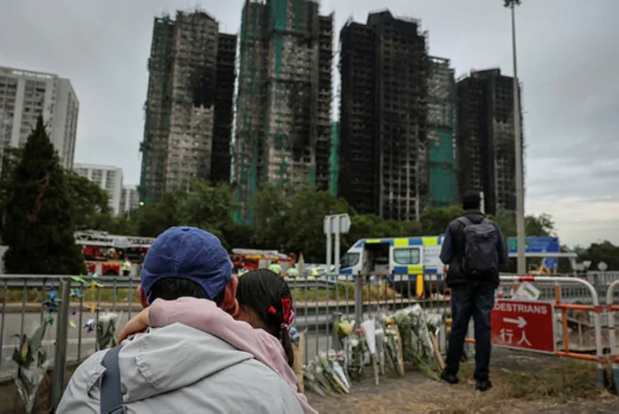 Hong Kong proceeds with election amid grief and anger over deadly fire Hong Kong proceeds with election amid grief and anger over deadly fire