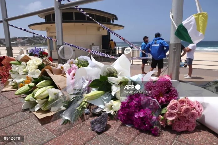 Australian lifeguards hold silent tribute for Bondi Beach shooting victims