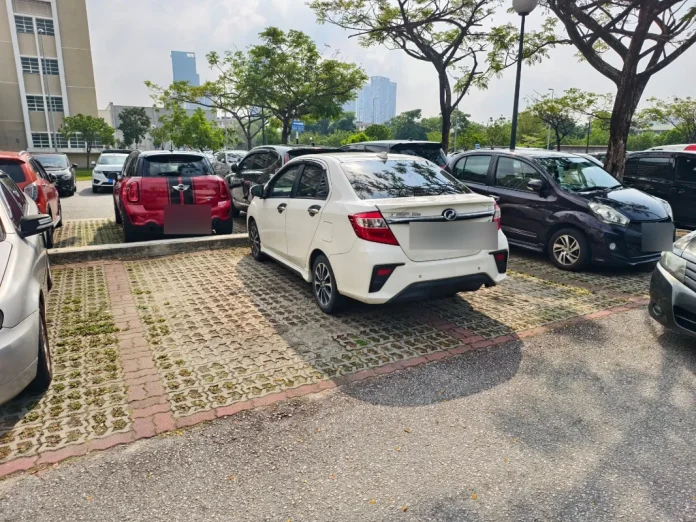 Perodua Bezza driver parks across 2 parking lots, gets angry notes