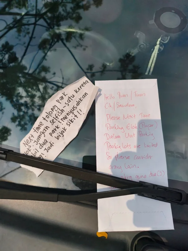 Perodua bezza driver parks across 2 parking lots, gets angry notes