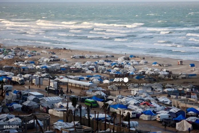 'Shivering from cold and fear': winter rains batter displaced Gazans