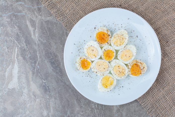 Boiled tasty eggs with spices on white plate M'sian teacher moved to tears after student brings boiled eggs to school potluck