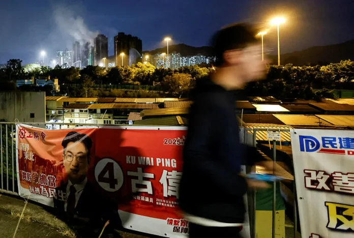 Hong Kong faces low election turnout as residents mourn deadly fire