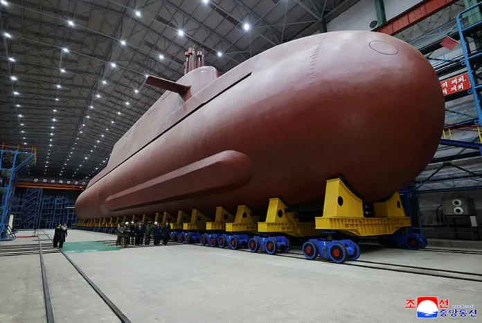 northkorea-politics-missiles North Korea's Kim Jong Un oversees test-firing of long-range missiles, KCNA says