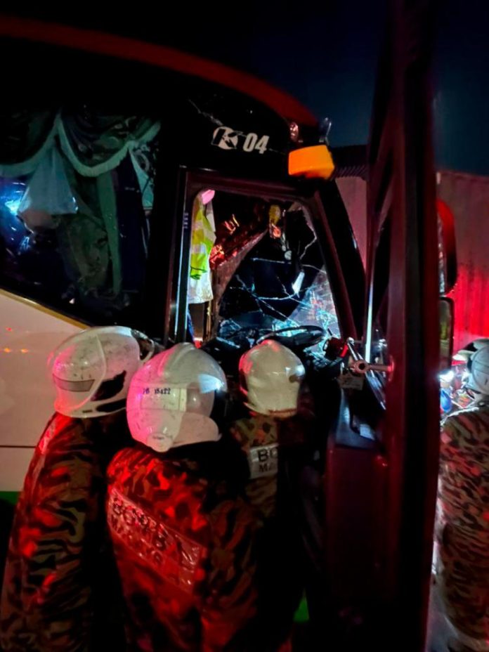 23 injured as tour bus rear-ends container lorry