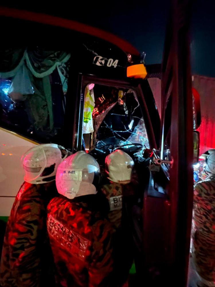 23 injured as tour bus rear-ends container lorry