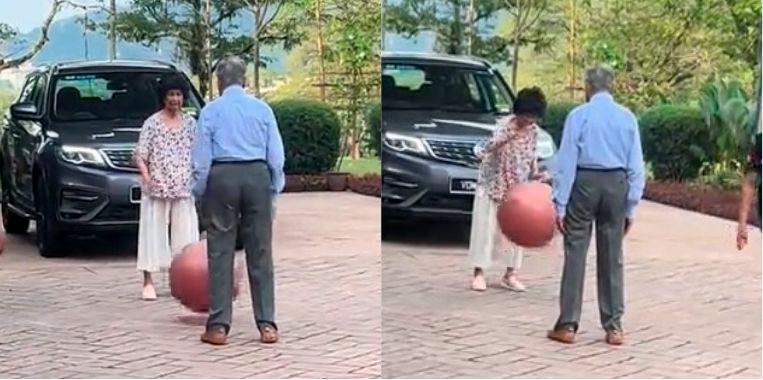 Adorable moment captured between Tun M and wife playing catch ball in KL