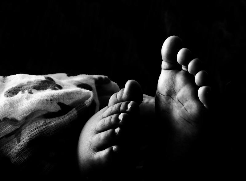 Baby dies pinned under arm of father who suffered fatal heart attack