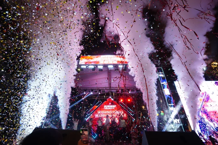 Thousands count down the final seconds of 2025 as fireworks light up the sky over Jalan Peel during Sunway Velocity Mall’s New Year’s Eve concert.