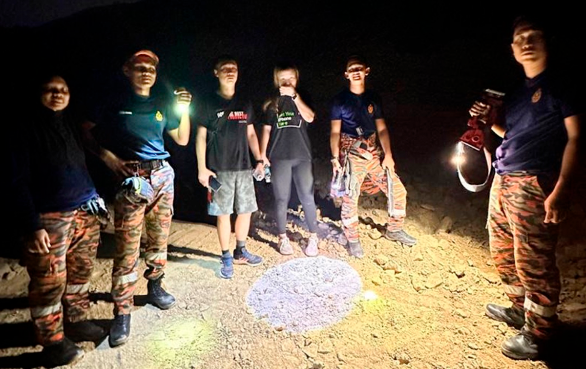 Firemen rescue two exhausted hikers at Teluk Bahang Forest Park Firemen rescue two exhausted hikers at Teluk Bahang Forest Park