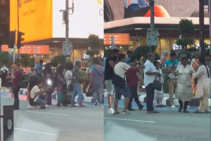 Foreign_photographers_block_KLCC_lanes__locals_frustrated