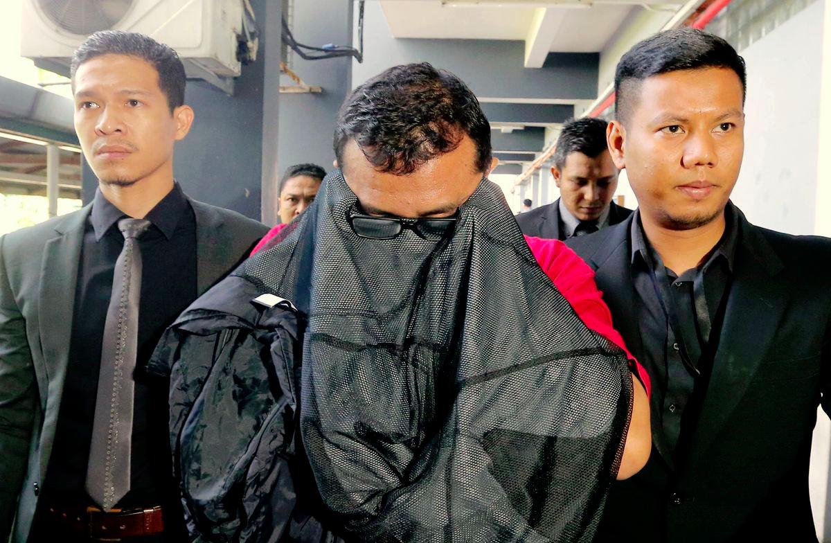 Former Perak immigration officers acquitted on corruption charges Former Perak immigration officers acquitted on corruption charges