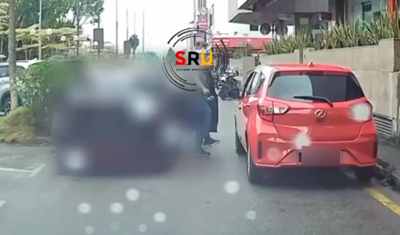 Frustrated man kicks Myvi for parking on yellow line, making it difficult to reverse out Frustrated man kicks Myvi for parking on yellow line, making it difficult to reverse out