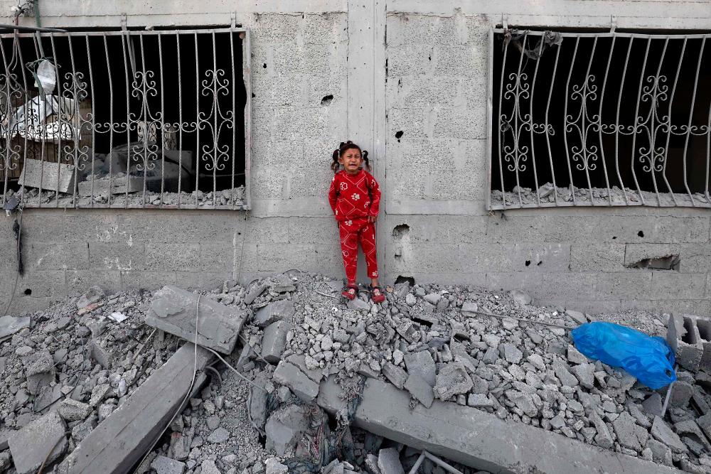 Gaza rescuers say nine children among dead in Israel strike on UN building