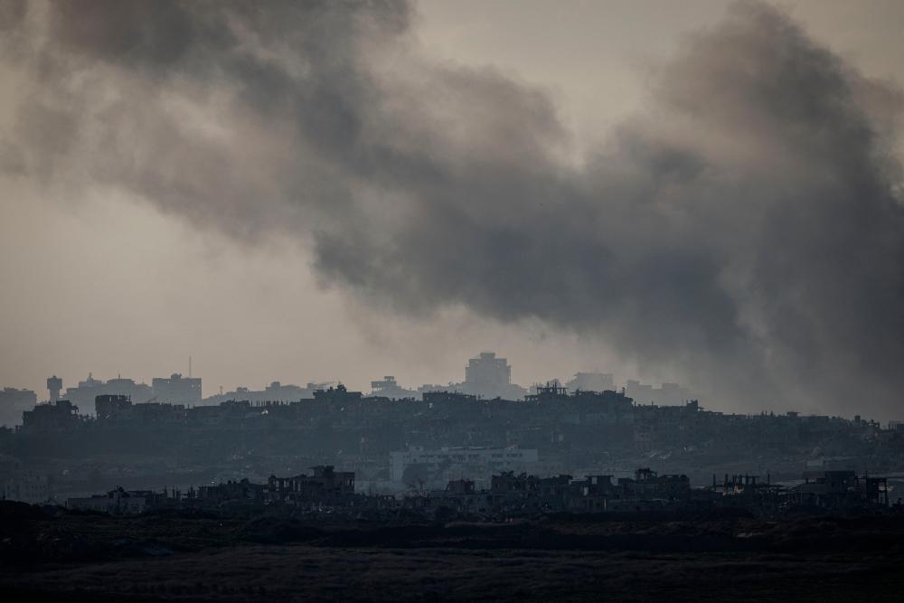 Israel approves Gaza ceasefire, carries out more attacks