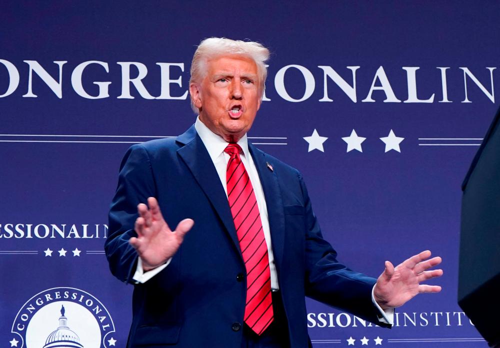 Judge weighs temporary block of Trump’s freeze on grants, loans