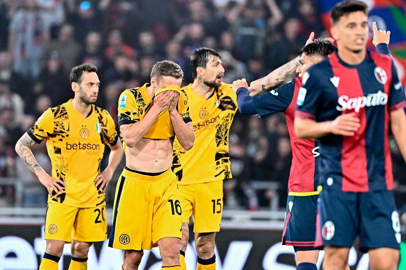 Leaders Inter level with Napoli after falling to late Orsolini stunner at Bologna