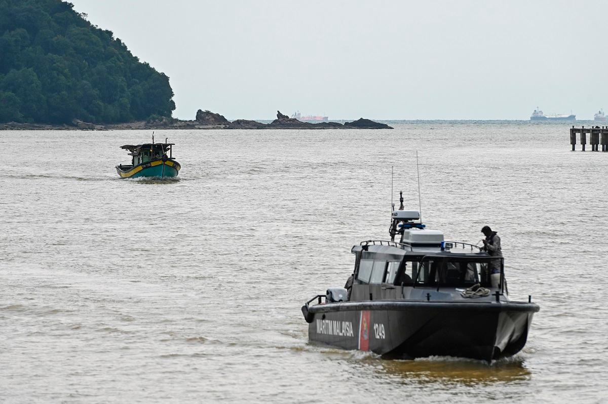 Man missing, two others safe after boat hit by fishing vessel