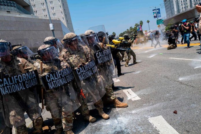 National Guard deploys in LA as Trump warns of 'troops everywhere'
