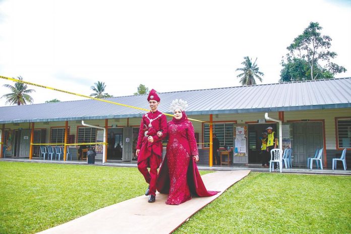 Newlywed couple adds colour to voting day