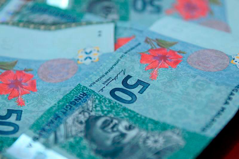Ringgit opens slightly higher vs USD