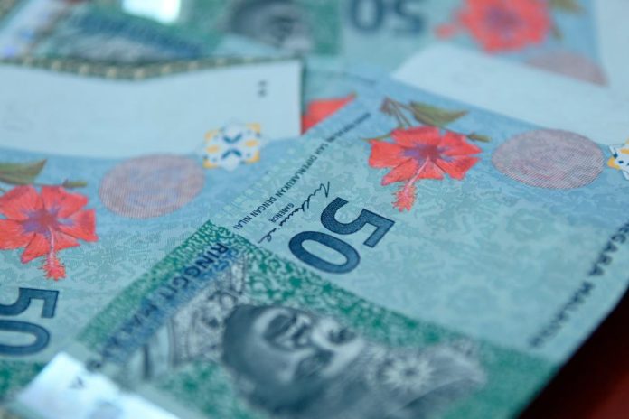 Ringgit rises as markets digest Fed minutes
