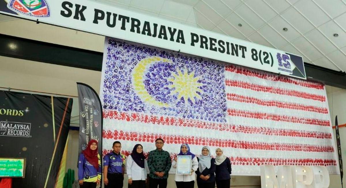 Special education students set record with giant hand-stamped Jalur Gemilang