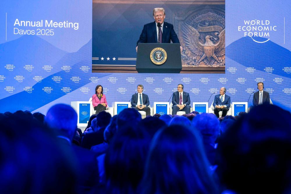 Trump tells Davos elites: produce in US or pay tariffs