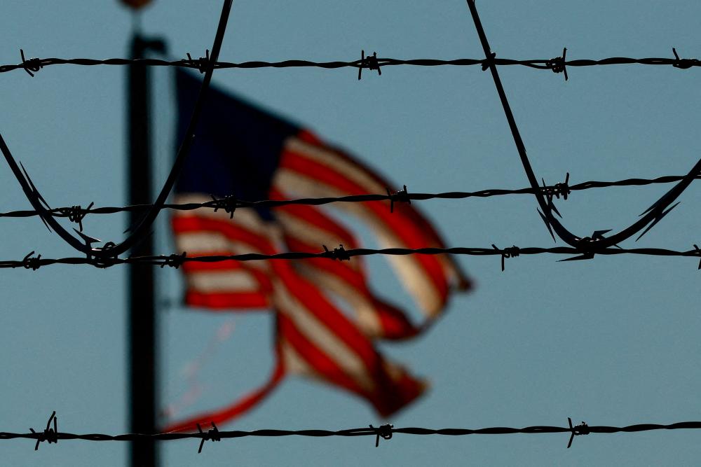 US military aircraft deport migrants as Pentagon readies more troops for border
