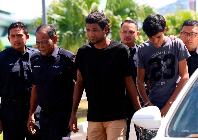 Unemployed pair charged with murder of man and adopted son Unemployed pair charged with murder of man and adopted son