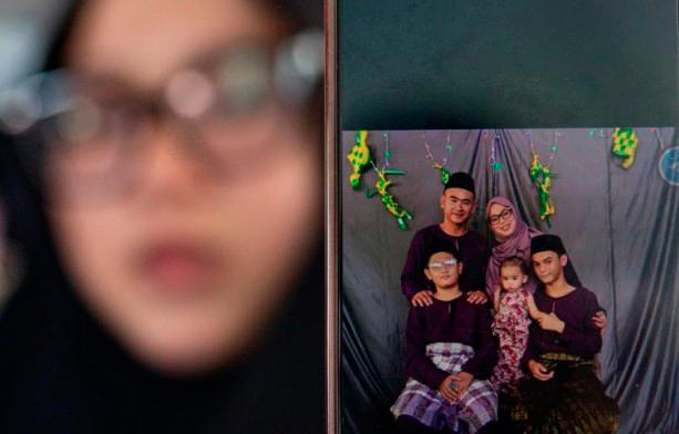 Wife recounts how corporal killed in Teluk Intan crash comforted her before leaving Wife recounts how corporal killed in Teluk Intan crash comforted her before leaving
