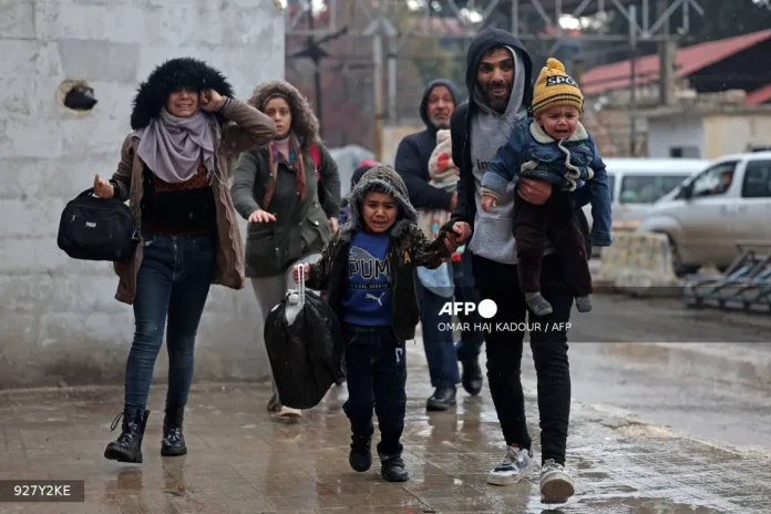 afp-20260109-927y2ke-v1-mockup-syriaconflictkurdsaleppostrike Syrian army says swept Aleppo district after clashes with Kurdish fighters