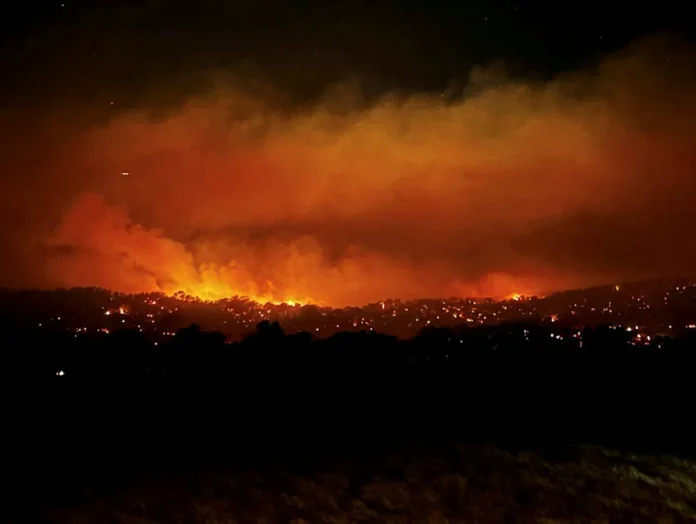 Three people missing as bushfires destroy homes in Australia's southeast