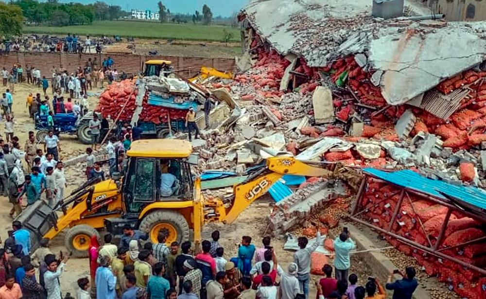 14 killed as roof of storage facility collapses in India