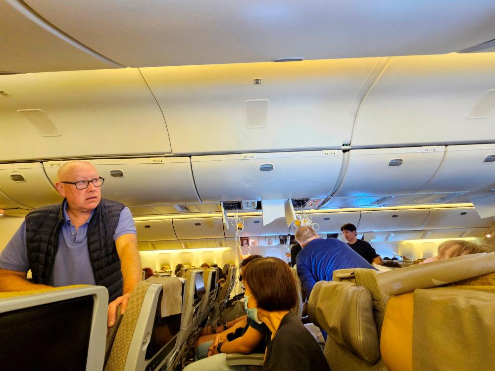 Brain, skull and spine injuries on turbulent Singapore flight Brain, skull and spine injuries on turbulent Singapore flight