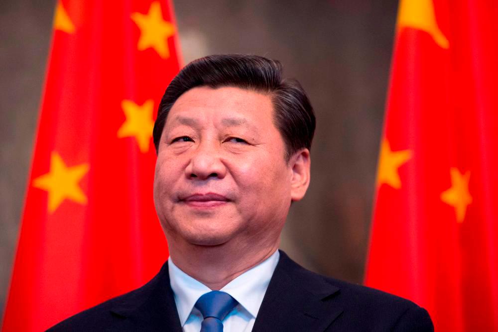 China's Xi looks to strengthen Vietnam ties after Biden visit