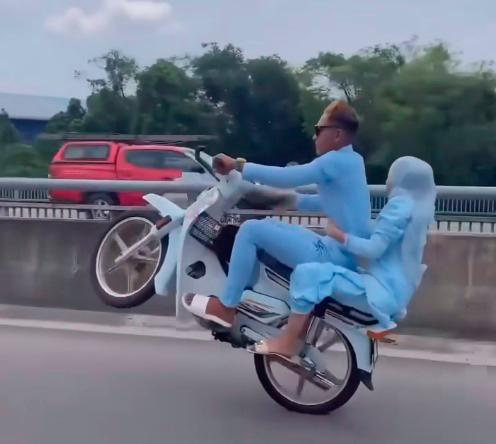 Couple in ‘wheelie’ viral video surrender to police Couple in ‘wheelie’ viral video surrender to police