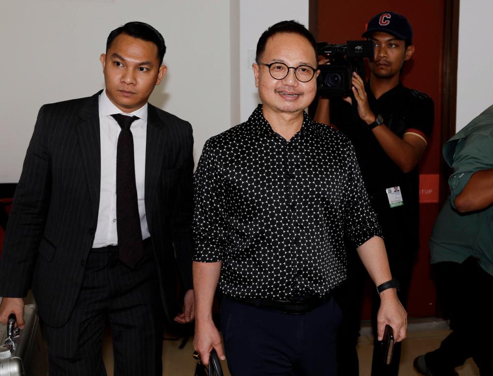 Ex-CEO of automotive institute claims trial to nine money laundering charges Ex-CEO of automotive institute claims trial to nine money laundering charges