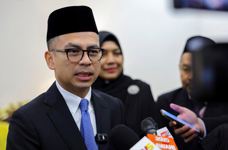 Fahmi condemns threats against journalists, wants swift resolution