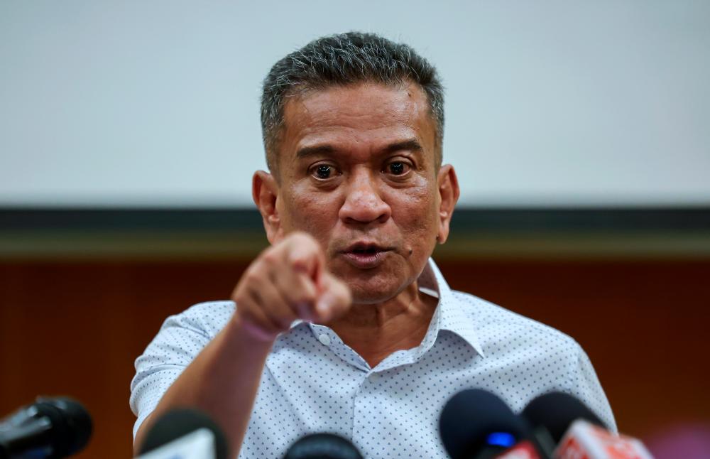 Former J-KOM DG arrives at Kajang district police headquarters to provide statement