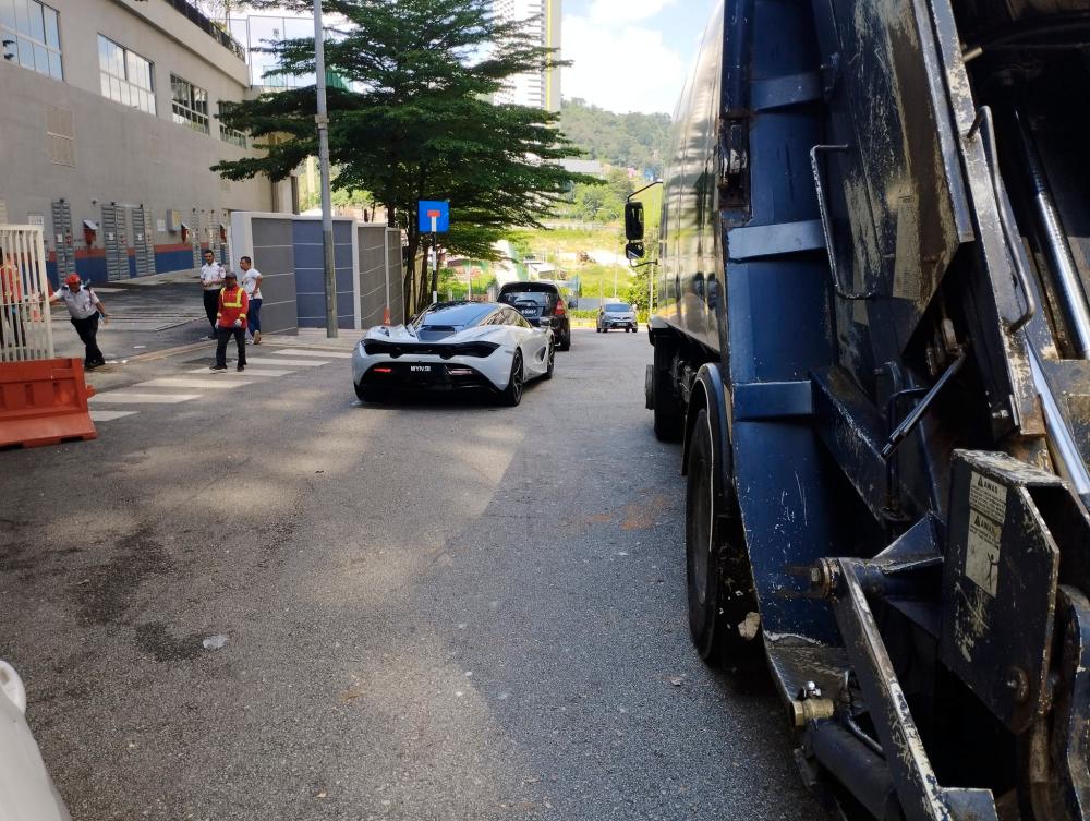 Illegally parked McLaren blocks garbage truck from entering condo in KL, netizens furious with inconsiderate driver Illegally parked McLaren blocks garbage truck from entering condo in KL, netizens furious with inconsiderate driver